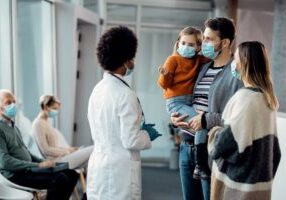 family of patients in waiting room during covid seeking care
