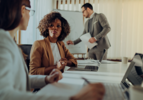 female healthcare business leaders discussing patient billing in june 2023