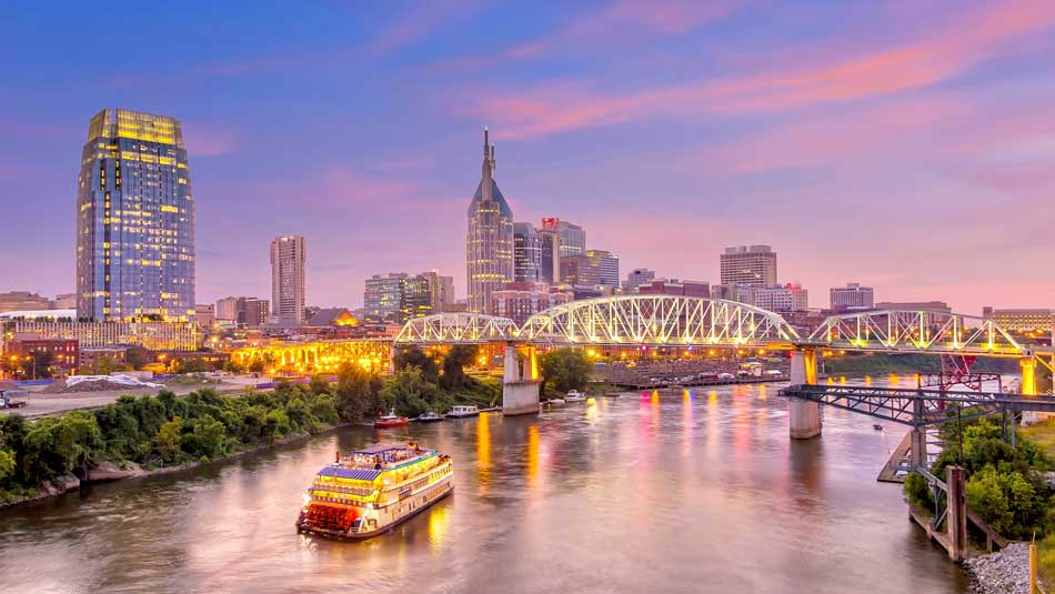 nashville city skyline and river during sunset